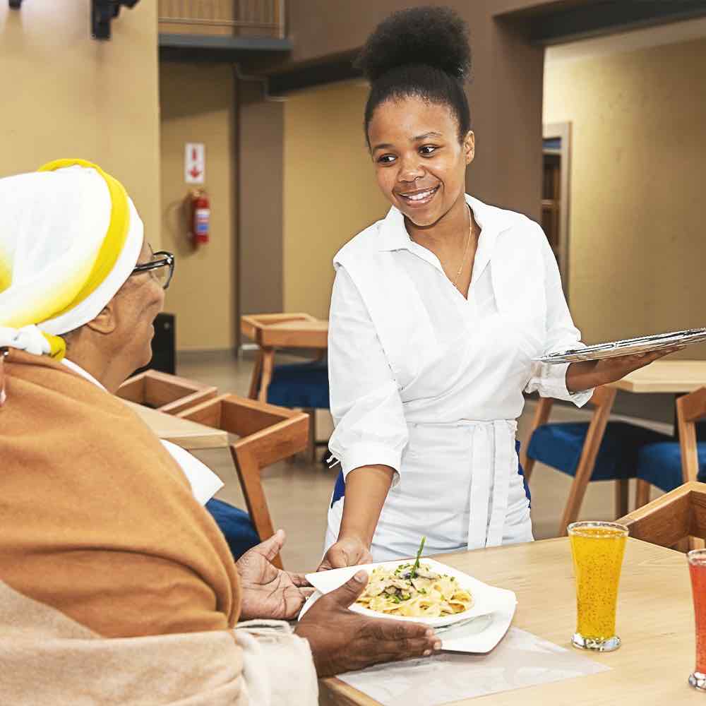 customer being served in the Isijula Boutique Hotel Restaurant Service