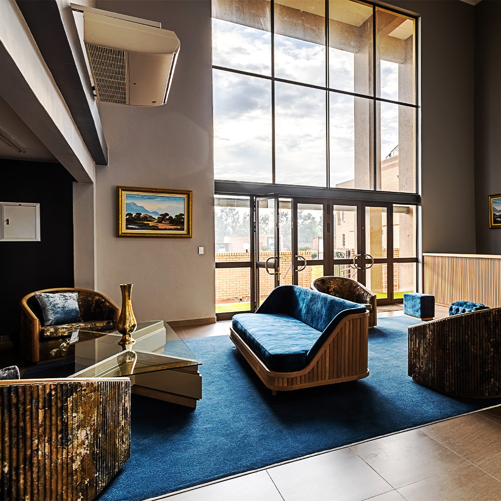 Isijula Boutique Hotel Reception Lobby with cloudy sky lit by the sun in the background