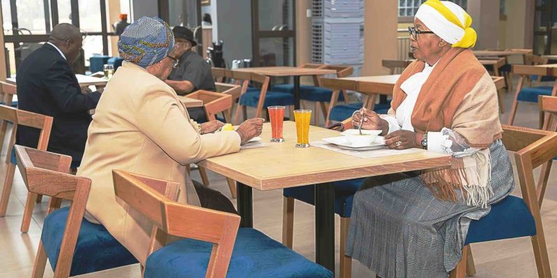 Image shows two woman enjoying a meal in the Isijula Boutique Hotel Restaurant